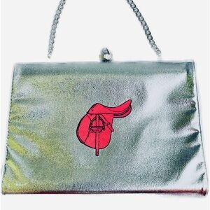 Metallic silver evening clutch that can play during the day or just a hot date!!